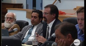 From left, Larry Layton, Ed Porter, Mark Distaso, Michael Fox (foreground), and Matt Ridenour discuss Einstein Academy's charter petition at a hearing in December.