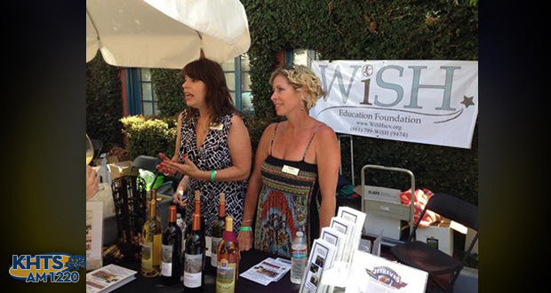Hart district spokeswoman Gail Pinsker, left, and WiSH Foundation executive director Amy Daniels,, volunteer at a fundraising event for the Hart district