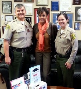 From left, Deputy Joe Trejo promotes the Sheriff's Toy Drive at KHTS AM-1220 with Janice Murray and Regina Yost 