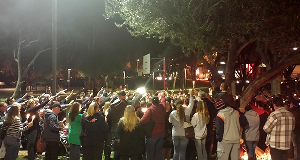 Just hours after the charges for a man accused of murdering his 19-day-old girl were announced, dozens of people from the Santa Clarita Valley community gathered at a candlelight vigil to support the victim’s family.