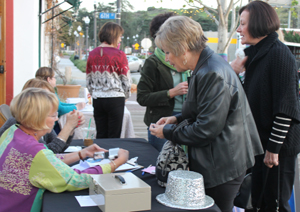 Guests sign in for the Zonta Club of Santa Clarita Valley's "Lunafest" at the Canyon Theatre Guild. Photo by Michele E. Buttelman.
