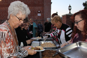 Guests line up for dinner prior to the film screening at "Lunafest." Photo by Michele E. Buttelman