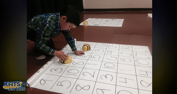 Kindergartner Tyler Do dashed around a 3-by-3 mat on the ground covered with numbers that made it look like a multiplication table at Mitchell Community Elementary School for the STEAM Expo.