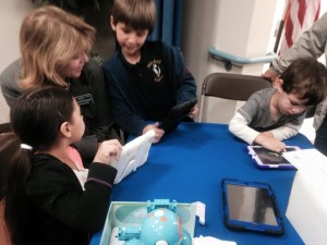 District Superintendent Catherine Kawaguchi interacts with first-graders at the science fair.