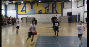 Santa Clarita Valley Sheriff's Station deputies play a pickup basketball game at Castaic Middle School.