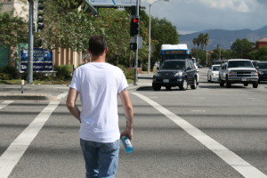 Deputy Kevin Duxbury crossing the street on the intersection of Whites Canyon Road and Soledad Canyon Road.
