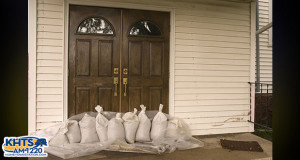 Stock photo of sandbags in front of a home