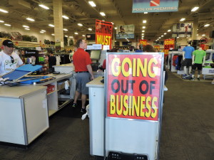 store employees attempting to ring up the large number of customers attracted by the store closing sales. 