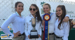 Paris Garrison, Bella Janaslani, Michelle Beaton-Kent and Sarah Valdiva display the trophy the Sierra Vista Equestrian Team won Sunday.