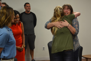 Holen is reunited with her daughter, who was away at school. 