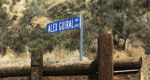 A Los Angeles police officer who started a rifle course for police recruits at the Oak Tree Gun Club in Newhall was recently honored for 27 years of service and instruction with the renaming of a road that leads into the rifle range.