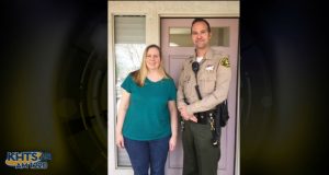 Deputy Duxbury poses alongside a woman he resuscitated after he and his partner noticed her not breathing in her van.
