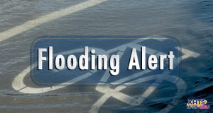 Louie: Flooding Alert Slider: Several inches of water over bike lane on street, reads "Flooding Alert"
