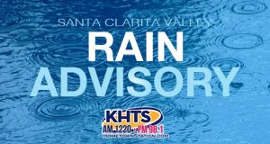 Louie: Rain advisory slider_Water droplets on water, reads "Rain Advisory"