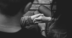 Couple holding hands