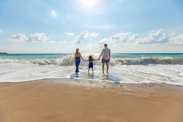 Family at the beach in the Water