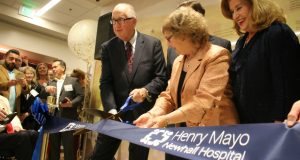 A picture of several Henry Mayo officials cutting a ribbon.
