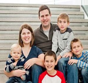 Jacob and Katie Evans with their four boys.