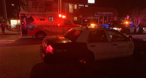 The red lights from an SCV Sheriff;s vehicle illuminating Oak Ave.