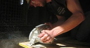 Man cutting with circular saw