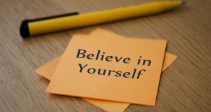 Note with "Believe in Yourself" written on it
