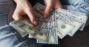 Hands holding money