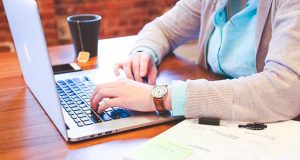 Student with laptop online