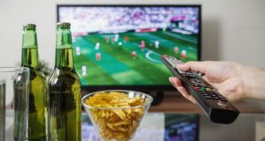 TV with remote control and snacks