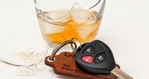 Broken Whiskey glass and car keys