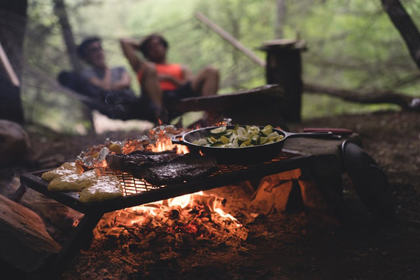 Food cooking on campfire