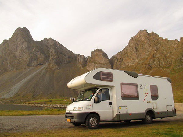 Camping trailer driving to the mountains