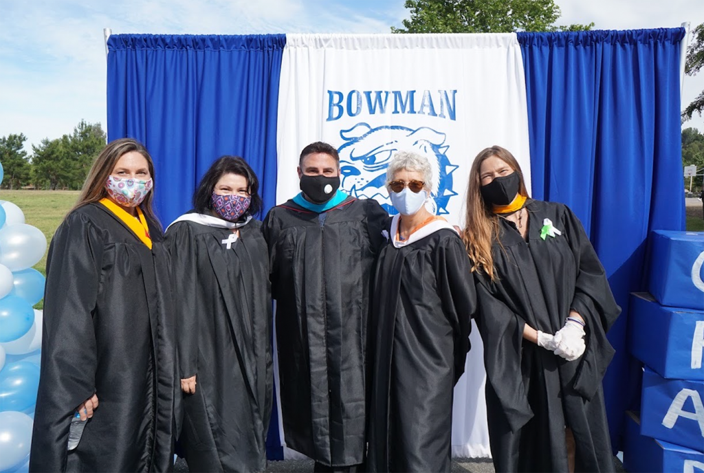 Bowman staff in gowns and masks.