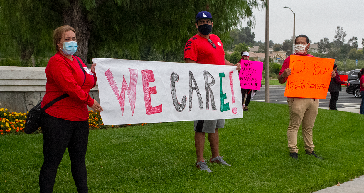 Henry Mayo Nurses holding a sign that reads "WE CARE!" and another that reads "Do You?"