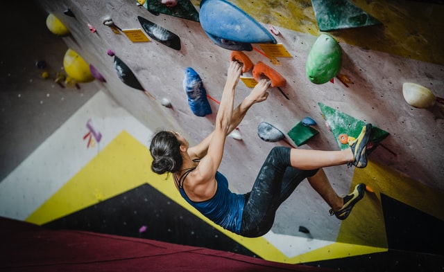 Woman wall climbing