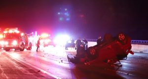 Single car rollover crash ont he 14 freeway, nighttime with emergancy vehicle lighting the scene
