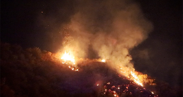 Fire burning on the hills to the southwest of Gravett Place in Canyon Country.