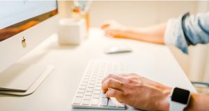 Man on Mac Computer