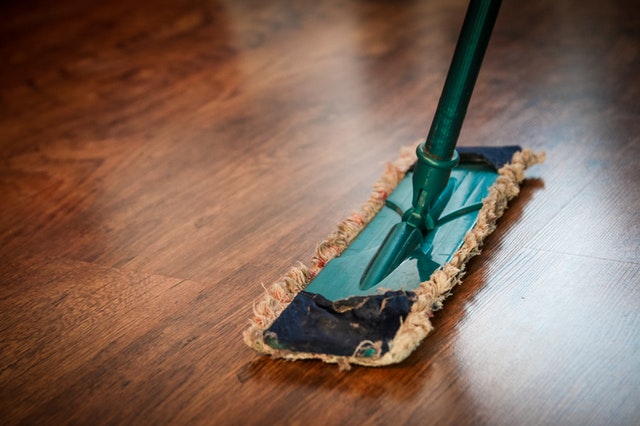 Cleaning brown wooden floor