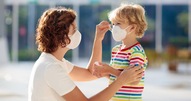 Woman and kid wearing masks