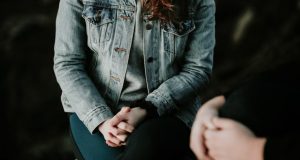Woman sitting with therapist