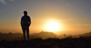 Man looking at sunset