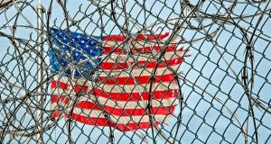American Flag behind fence