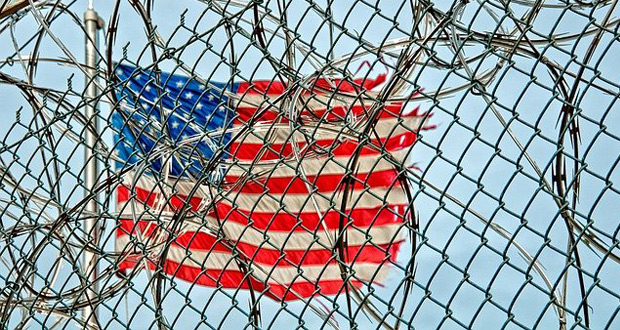 American Flag behind fence