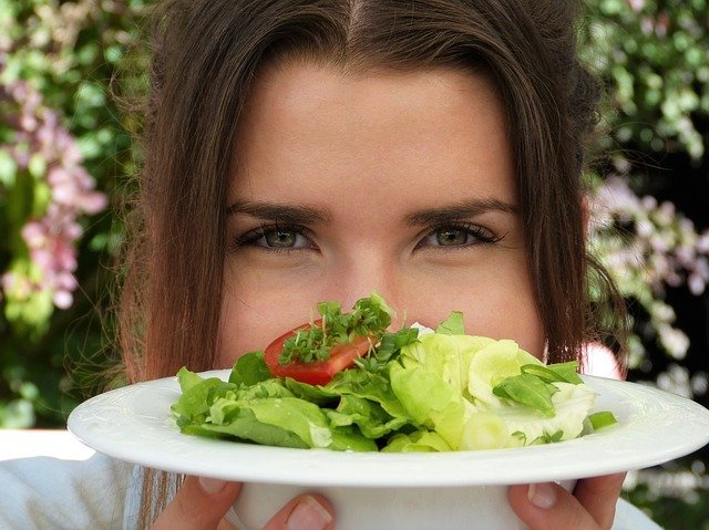 Woman holding a salad