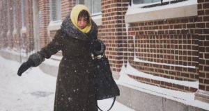 Woman walking in snow