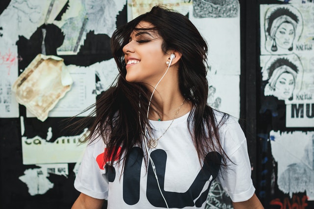 Woman listening to music with ear buds