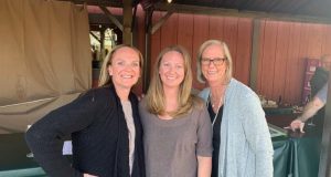 Dorsey family sisters and mother standing together for photo