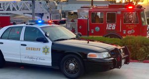 Sheriff's crown vic and ladder truck 126 in the parking lot near the four corners in saugus