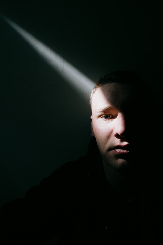 Man in dark room