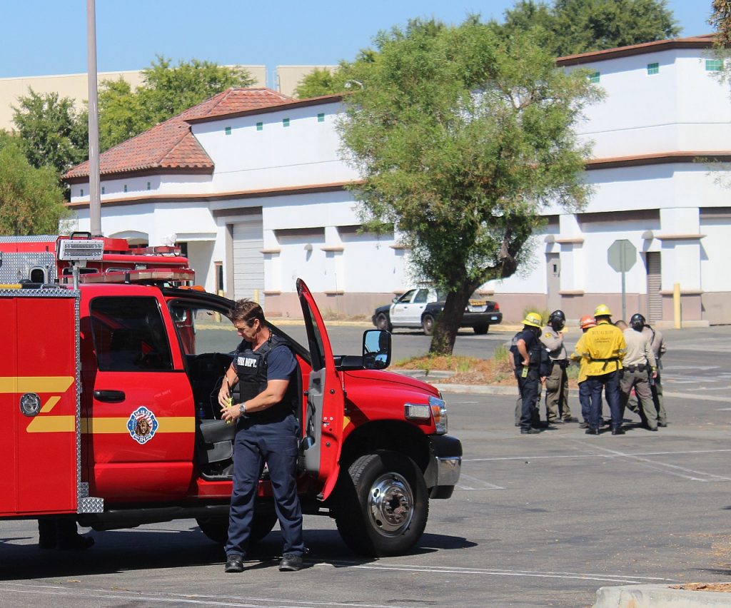 A paramedic with the Los Angeles County Fire Department exits a vehicle
